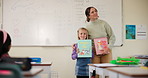 Teacher, student or child for presentation in classroom, learning and kindergarten education. Woman, kid and show to talk in class to speak to audience for assessment, speech or development at school