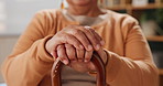 Hands, senior patient and cane in house for support, balance and recovery from injury in retirement. Elderly woman, walking stick and rehabilitation from stroke, accident and person with disability