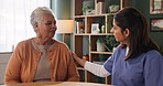Senior woman, consultation and caregiver with patient in elderly care, support or discussion at old age home. Female person or medical nurse listening and talking to client for health advice or help