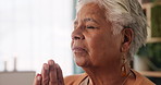 Senior woman, prayer hands and faith in home with worship, thanks and connection to God in retirement. Elderly person, religion and peace in morning with gratitude, reflection and trust in apartment