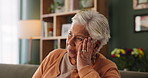 Senior woman, memory and thinking in home on sofa with reflection, mistake or sad in living room. Elderly person, widow and remember with regret, worry or depressed with mental health in retirement