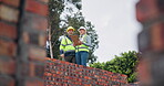 Clipboard, teamwork and people at construction site with floor plan development, renovation or housing project. Architecture project manager talking of design progress, layout and industry checklist