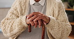 Hands, senior patient and walking stick in home for support, balance and recovery from injury in retirement. Elderly man, cane and rehabilitation from stroke, accident and person with disability