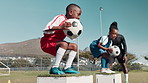 Soccer ball, practice and team of kids with drill for coaching, exercise and training for match. Children, growth and boys on field with teamwork for sports workout, development and outdoor routine