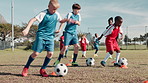 Soccer ball, sports and children dribble for training, workout and exercise for practice, learning and fitness. Youth, field and kids with coach and equipment for playing games, match and competition