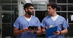 Clipboard, tablet and team of doctors in hospital for discussion on medical diagnosis and treatment. Checklist, digital technology and men healthcare employees walking and planning surgery in clinic.