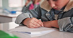 Exam, hand and students in classroom with paper, learning and pencil for assessment in elementary school. Quiz, studying and knowledge for young person, curriculum and desk for course test closeup