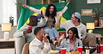 Friends, high five and celebration on sofa watching tv for soccer, world cup or sports event in living room. Brazil flag, diversity and people with alcohol, excited or goal from football team in home