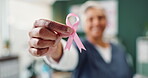 Ribbon, hand and breast cancer awareness for healthcare, support and empathy with nurse in office. Community, medical care and examination for prevention, treatment and female person advocate 