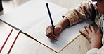 Letters, child and hand on desk, writing and closeup of education, notebook and student in middle school. Classroom, studying and practice for exam, growth and development of kid, alphabet and table