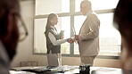 Business, handshake and meeting in office for finance, financial agreement and welcome in boardroom. Businessman, woman and deal in workplace for commitment, negotiation and partnership in investment
