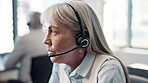 Face, mature woman and employee at call center with chat for customer support and service. Office, crm and advisor or consultant in conversation, telemarketing and communication at help desk