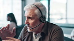 Call center, businessman and headset with discussion in office for telecom, assistance and advice. Mature person, consulting and tech with conversation for b2c help, customer service or telemarketing