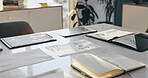 Documents, meeting and equipment on table in empty office for finance stats, notes and audit report of company budget. Paperwork, data analytics and analysis sales, graph and chart of profit growth
