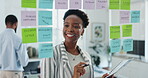 Woman, glass and sticky notes in office for strategy, productivity schedule and creative agency for growth. Brainstorming, goals and employee for mind map, workplace and happy or smile for idea