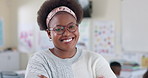 African teacher, woman and arms crossed in classroom with face, smile or happy for education at school. Person, excited and pride in portrait for career by children for learning, scholarship or test