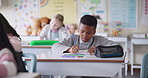 African boy, child and writing in classroom with studying, listening or information for education at academy. Pupil, school kids and notes in book for learning, scholarship or lesson for assessment