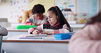 Classroom, school and kid writing in books for lesson, language skills and learning for assessment. Education, students and young girl with notebook for drawing, creativity and child development