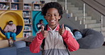 Boy, thumbs up and happy at school with face, library or smile for education, yes and feedback. African child, sign and portrait with icon, like or choice for learning, thanks or academy in Chicago