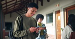 Boy, texting and happy on smartphone in high school, communication and gen z student laughing for online meme. Social media, typing and smile for education website results, connection and mobile app