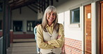 Portrait, arms folded and teacher on campus of school for knowledge, career and education. Woman, pride and professor or employee for development, curriculum or lecture for English academy or college