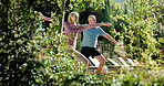 Outdoor, stretching and senior couple with yoga in garden for wellness, balance or workout. Health, pilates and elderly man with woman for body care, retirement or warrior pose on weekend in backyard