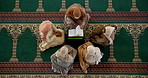 Quran, school and group of women in mosque for spiritual worship, faith teaching and Islamic religion from above. Culture, dua and Muslim people on carpet with reading, morning class and prayer book