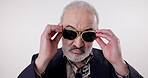 Face, fashion and senior man with sunglasses isolated on white studio background. Confidence, portrait and cool person in shades, stylish suit and trendy clothes in retirement on backdrop in Spain