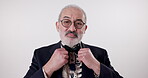 Fashion, portrait or senior man in studio with bowtie, pride or stylish on white background. Retired writer, male person or new frames for vision with trendy outfit, health or care for accessories