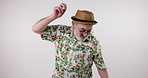 Dance, celebration and senior man in studio on white background for fun retirement, moving and rhythm. Party, music and funky fashion with happy elderly person dancing on mockup backdrop for freedom