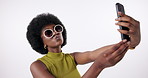 Black girl, selfie and sunglasses for fashion in studio on isolated white background with fun. Content creator, gen z and happy in trendy or colorful style, summer clothes and designer brand