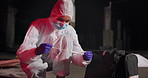 Swab, crime scene and person with evidence for investigation, inspection and forensic analysis. Hazmat suit, night and investigator with sample for criminal clues, accident and observation in city