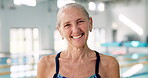 Portrait, old woman and smile in swimming pool, healthy and happy for exercise in water and training. Wellness, joy and senior person in swimsuit, event and sport for fitness with physical therapy