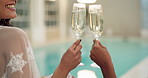 Women, relax and drinks at hotel pool for holiday, happiness and cheers with glass, alcohol and smile Friends, champagne and celebrate together at luxury resort for vacation, wellness and travel