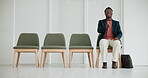 Office, anxiety and black man with handshake in waiting room for job interview, preparation and planning. Human Resources, candidate and watch with offer gesture for hiring, meeting and overthinking