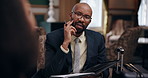 Black man, working and conversation in hotel with paper for questions, speaking with employee for hospitality. Male recruiter, resort and communication with employee for interview or recruitment