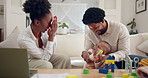 Black family, parents and play peekaboo with baby for learning, education and development. Happy mother, father and kid with funny game, laugh and teaching child building blocks while working in home