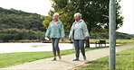 Friends, walking and senior women in park outdoors together for bonding, fresh air and relax in nature. Retirement, happy and mature people in conversation for wellness, health and active lifestyle