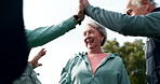 Fitness, senior people high five with motivation in park for exercise, teamwork or training success. Low angle, friends and happy in achievement with celebration for workout, support or collaboration