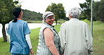 Assisted living, back or retirement with nurse and old women walking outdoor together for activity. Healthcare, friends and portrait of senior person in garden with happy caregiver for wellness