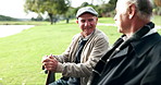 Talking, senior men and park bench with reunion, support and care by garden lake with smile outdoor. Conversation, happy and relax elderly friends in retirement with wellness in the morning together