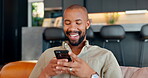 Smile, black man and phone for typing at house for reading news, communication notification and scroll on social media. Happy, male person and mobile for networking, online chat and entertainment
