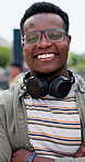 Happy student, black man and face with headphones in confidence for education, learning journey or future ambition at campus. Portrait of young African, male person or smile for college scholarship