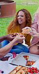 Woman, friends and pizza outdoor on campus for picnic, together and happy for nutrition at college. University student, diversity and food in park or garden with gen z people on lawn for lunch break