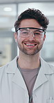 Portrait, scientist and happy man in lab for research, career and job as biochemist. Confidence, pathology and face of medical doctor in goggles for pharmaceutical study, healthcare and innovation