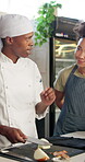 Explain, culinary student and chef with kitchen for teaching, skills development and knife technique. Cooking class, male cook or cut with trainee for learning, education or listening to professional