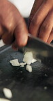 Culinary, hands and knife with onion for cut, chop and food preparation technique for fine dining on table. Kitchen, person and professional chef with raw vegetable, hospitality and cooking skills