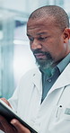 Black man, doctor and tablet with healthcare, clinic or hospital software for patient history or test results. Medical worker or physician on digital technology for online research or problem solving