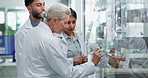 Scientist, team and writing with glass in laboratory for tracking experiment progress, brainstorming and research. Science, collaboration and equation or formula for prediction, analysis and theory.
