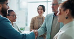 Happy, business people and handshake with applause for meeting, promotion or teamwork at office. Group of young employees shaking hands or clapping for deal, agreement or congratulations at workplace